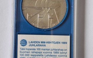 Lahden MM-hiihtojen 1989 100mk juhlaraha erikoiskotelossa.
