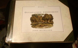 John Buckland  OIVALLINEN PERHOMIES ( 1 p. 1991 ) Sis.pk:t