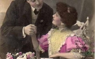 RAKKAUS / Mies pitää tummaa tyttöä kädestä. 1900-l.