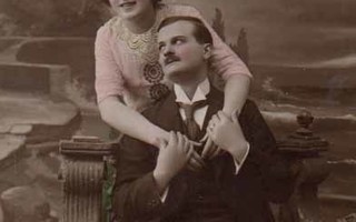 RAKKAUS / Istuva mies pitää kaunista tyttöä käsistä. 1900-l.