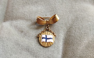 Rintakoru Suomen lipulla