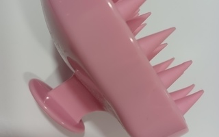 Pinkki käyttämätön shampoo harja