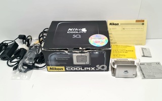 Nikon Coolpix SQ digikameran laturi, telakka, laatikko yms
