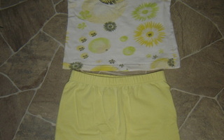 Keltasävyinen T-paita ja keltaiset shortsit, koko 110 cm