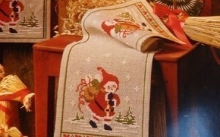 Ristipistomalli kaitaliinaan Joulupukki lahjoja tuomassa