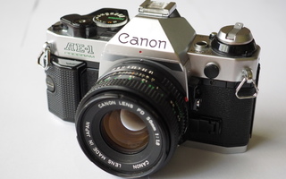 Canon AE-1 Program + Canon FD 50mm. objekti.
