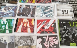 U2 paketti. 8 CD singleä. 4 DVD singleä. 2 albumia ja kirja.