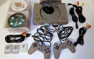 PlayStation (SCPH-1002) RCA-liittimillä, ohjaimet ja pelejä