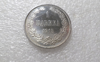 1 mk 1915  hopeaa  lyöntikiiltoinen   rahakehyksessä.