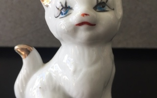 Posliininen vaalea kissa figuuri
