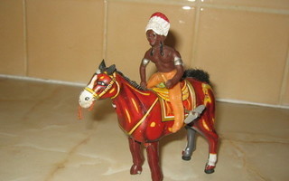 Vanha peltilelu, hevonen ja ratsastava intiaani