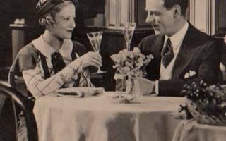 RAKKAUS / Nuori nainen ja mies juovat sampanjaa. 1930-l.