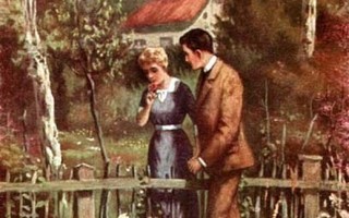 RAKKAUS / Rakastunut pari kävelee aidan vierellä. 1910-l.