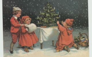 Puna-asuiset lapset koristelevat joulukuusta