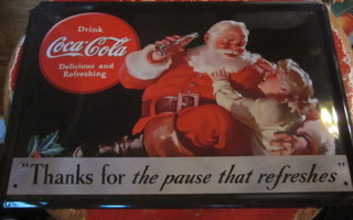 Peltikyltti Coca-Cola. Joulupukki ja tyttölapsi