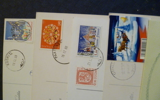Nippu leimatuin postimerkein kulkeneita kortteja