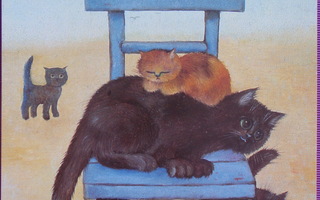 Renate Koblinger kissat sinisellä tuolilla