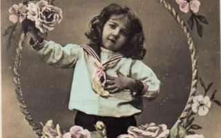LAPSI / Tummahiuksinen pieni poika ja kukkakehys. 1900-l.