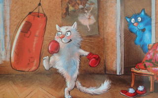 Irina Zeniuk kissalla nyrkkeilysäkki käytössä