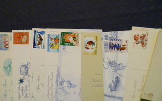 Nippu jouluaiheisin postimerkein kulkeneita kortteja