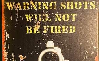Kyltti Warning shots will not be fired