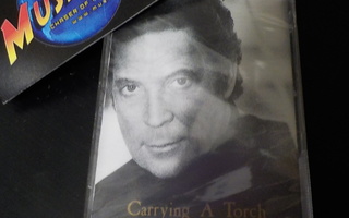 TOM JONES - CARRYING A TORCH UUSI C-KASETTI