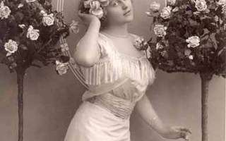 NAINEN / Vaalea tyttö ja ruusupuut. 1900-l.
