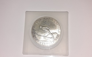Olympiaraha 50 schilling v. 1964, hopeaa
